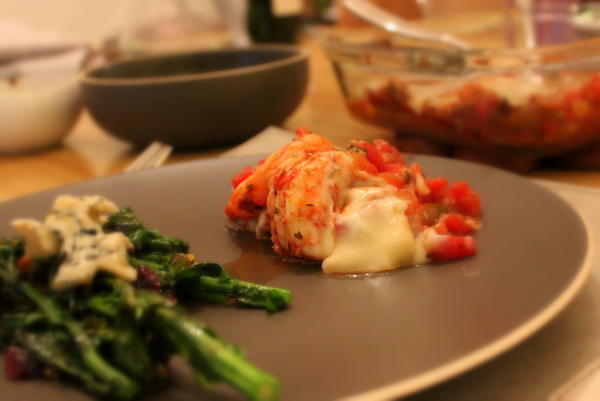 Shrimp Saganaki with sauteed Kale flowers